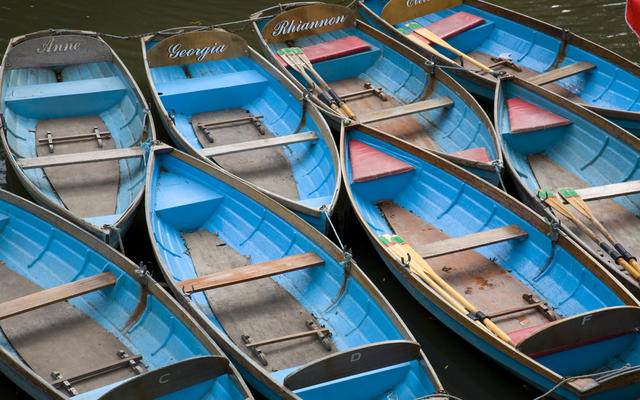 blue rowing boats moored