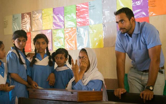 mohsin at his clinic in a classroom