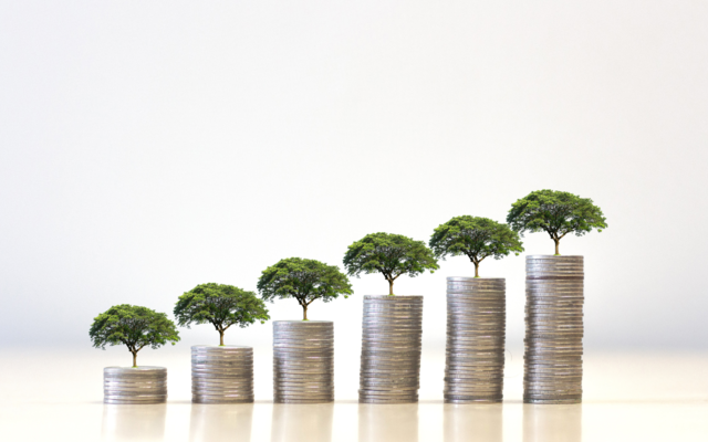 Towers of coins with trees growing out of them. 