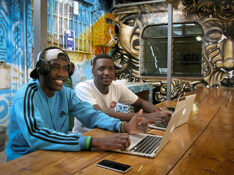 Two Andela students working in the chill-out area of the Nairobi campus.